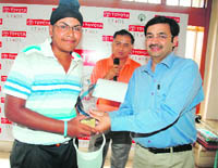 Tarundeep Chadha of Chandigarh receives the A category (16-18 years) trophy of the Junior Golf Tour at the Golden Greens Golf Resort in Gurgaon on Friday.