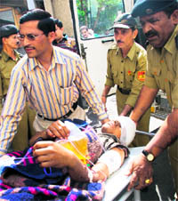 Two injured VDC members from Doda being brought to Government Medical College, Jammu, on Sunday. Tribune photos: Anand Sharma