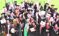 Students flaunt their degrees after the convocation ceremony at the Partap College of Education in Ludhiana on Sunday. 