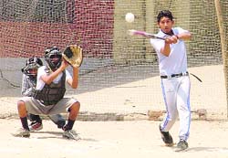 A striker swings at a ball during the Ludhiana District Softball Championship on Sunday