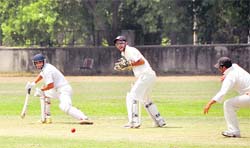 A batsman plays a shot during a match between Ludhiana and Chandigarh at the PAU, Ludhiana, on Sunday. 