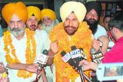 Gurbhajan Gill, winner of the Punjabi Sahit Akademi elections, with his supporters in Ludhiana on Sunday. 