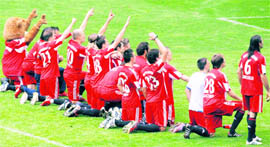 Bayern Munich players kneel in front of supporters after their match against VfL Bochum in Munich on Saturday