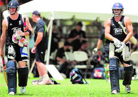 England cricketers Craig Kieswetter(L) and Michael Lumb come out to bat in the nets at the Everest Cricket Club in Guyana on Saturday.  AFP