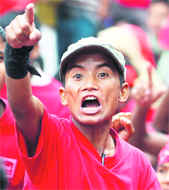 A Maoist activist raises anti-government slogans