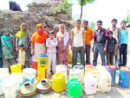Residents wait for water tankers arranged by the public health department at Plantra village in Morni block, Panchkula,