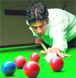 A player is all concentration during the billiards and snooker championship in Chandigarh