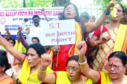 Members of the All-Assam Koch Rajbongshi Sanmilani demand ST status for their community during a protest in New Delhi on Monday.