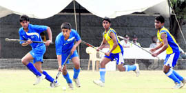 Players in action at the 6th S Kandhari Memorial Hockey Tournament in Dehradun on Monday
