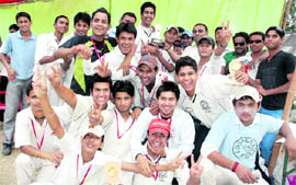 The team members of the Himalayan Cricket Academy cheer after lifting the u-17 cricket tournament in Dehradun on Monday. A Tribune photograph 