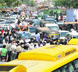 Traffic chaos in Gurgaon on Monday as villagers block a road to press for their demands.