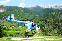 A helicopter takes off with tourists at Kothi village on the Manali-Leh highway 