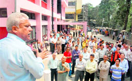 Employees of non-teaching departments shout slogans in front of Vice-Chancellors office at Himachal Pradesh University in Shimla on Monday