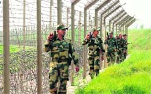BSF jawans keep vigil in the Kanachak sector close to the international border in the Jammu region on Monday. 