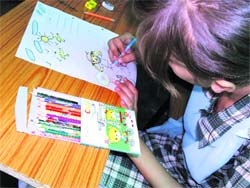 Students take part in a painting competition at Adarsh Shiksha Niketan Senior Secondary School, Resham Ghar, in Jammu on Monday.