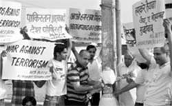 Activists of the All-India Anti-Terrorist Front, Haryana unit, burn the effigy of Ajmal Kasab at Ambala on Monday.