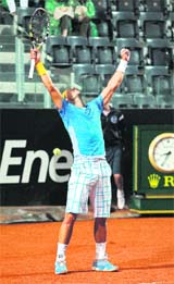 Rafael Nadal jubilates after defeating David Ferrer in Rome on Sunday. Nadal won 7-5, 6-2. 