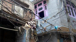 Electricity wires hang in the Katra Dulo area in Ward 47.