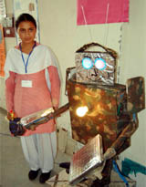 Kuranpreet Kaur, a student of Government High School, Gahri Mandi, shows her model of robot in Amritsar.  