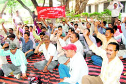 Forest employees hold a demonstration in Dehradun on Tuesday