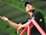 England captain Paul Collingwood watches the rain fall during a break in their match against the West Indies at Providence stadium in Georgetown 