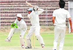 Sumit Ohri of Mohali team plays a shot in the Punjab Inter-District Cricket Tournament at Chandigarh on Wednesday.