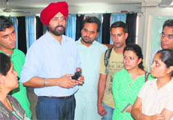 Professional trainers interact with students during a workshop at Panjab Universit in Chandigarh on Wednesday.