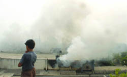 Smoke billows out from the factory in New Delhi 