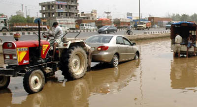 The Hero Honda chowk in Gurgaon's Sector 37 has been waterlogged for the past seven days.  Tribune photo: