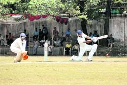 A batsman plays a shot during a match at the All-India Uttarakhand Gold Cup Cricket Tournament in Dehradun on Wednesday.