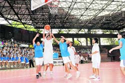 Players attempt a basket at the All-India Inter-School Girls' Basketball Tournament in Dehradun on Wednesday. 