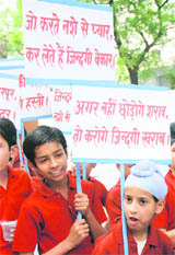 Schoolchildren hold a de-addiction rally organised jointly by the Art of Living and the Health Department in Karnal