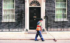 A street cleaner in front of 10 Downing Street in London on the eve of UK general election