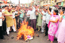 BJP activists protest against the proposed hike in the electricity tariff and unscheduled cuts in Jammu on Wednesday. A Tribune photograph