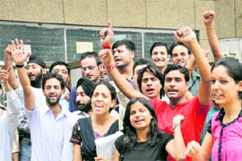 MBA students of fourth semester protest outside the examination block in Jammu University on Wednesday. 
