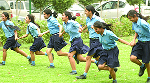 Schoolchildren enjoy the good weather near the Vijay Chowk park before watching the Parliament proceedings in New Delhi on Thursday.