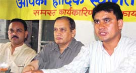 Bahadur Singh Rawat (right), Dehradun president of the UKD, addresses a press conference in Dehradun on Thursday.