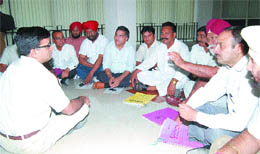 Congress councillors sit on a dharna, demanding provision of furniture in a hall set up for them in the MC complex in Jalandhar on Thursday. 
