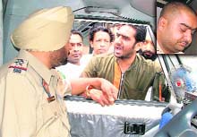 Councillor Satish Naggar argues with a police official after his brother (inset) was apprehended at the DMCH, Ludhiana, on Thursday.