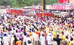 Agitators lay siege to the Ludhiana-Chandigarh road against police inaction in Samrala on Thursday.