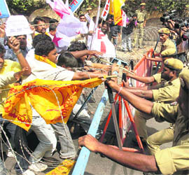 The police in action against activists of the Students Federation of India (SFI) and the Democratic Youth Federation of India (DYFI) demonstrating in front of ministers quarters demanding recruitment of special grade teachers and release of scholarship, in Hyderabad on Thursday.
