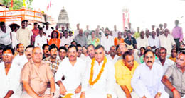 Congress leader Harak Singh Rawat, along with party workers, stages a dharna