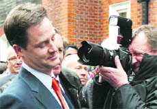 Liberal Democrat leader Nick Clegg is photographed as he arrives at the party headquarters in London on Friday.