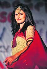 A Pakistani model presents a creation by Talat Khan at a fashion show in Karachi late on Friday.