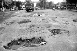 The pitiable condition of the road separating Sector 56 and Phase VI