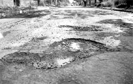 the road separating industrial area and Phases VII and VIII