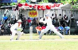 A batsman faces a delivery at the All-India Uttarakhand Gold Cup Cricket Tournament in Dehradun on Saturday. 