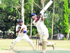 A batsman plays a shot at the Second Babu Farid Ahmed Memorial Cricket Tournament in Dehradun on Saturday. 