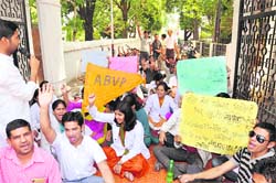 Students of Rishikul Ayurvedic Medical College protest at the college gate in Haridwar on Saturday.