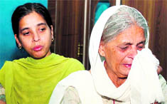 Raj Kumari, mother of Rajnish Sharma, and her daughter Santosh narrate their woes at their house in Jammu on Saturday